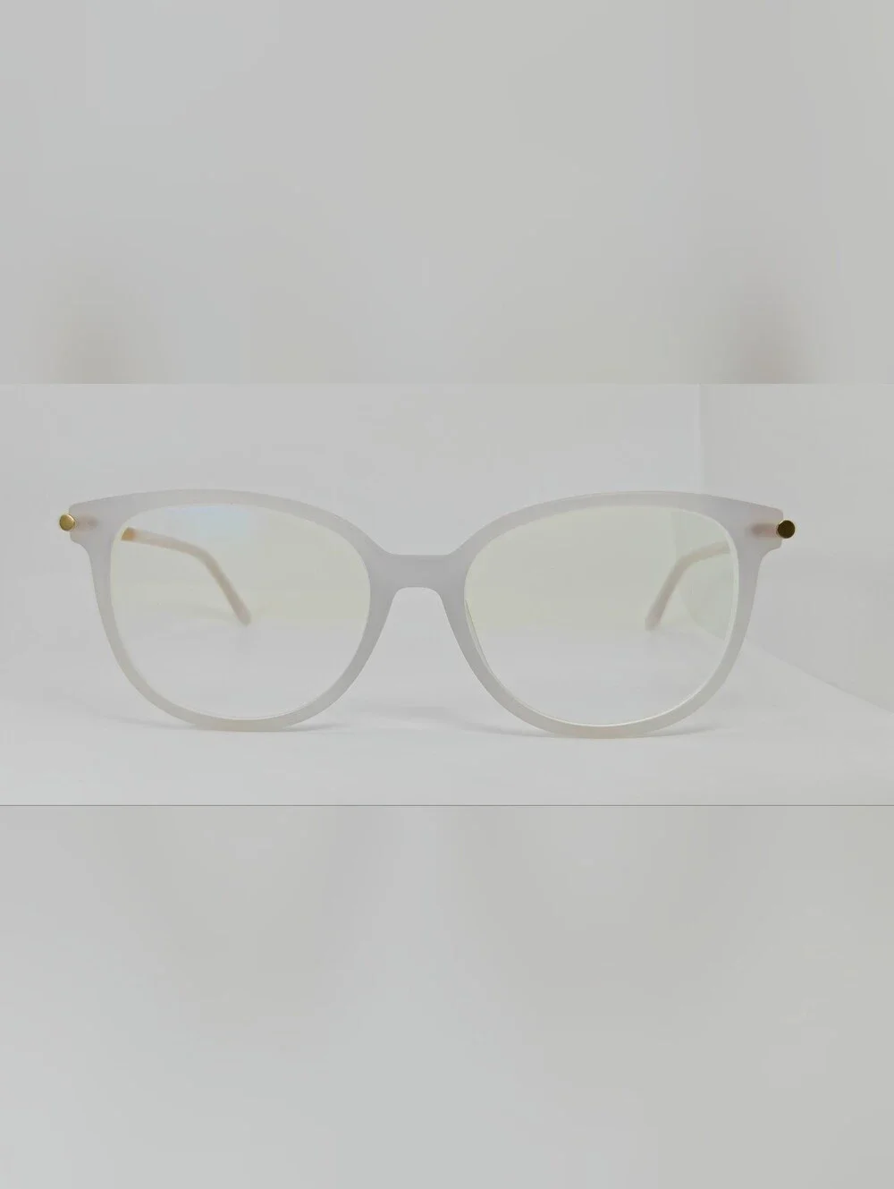 Cylinder. Women's Frosted White Round Frame Glasses. Cylinder Gold Highlights.